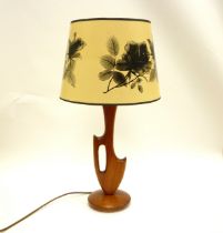 A c1960's shaped Teak table lamp with later shade. Base and fitting approx 41cm high