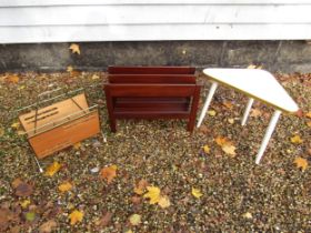 A Guy Rogers teak magazine rack together with a white melamine triangular table on tripod legs and a