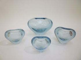 Four Per Lutken Holmegaard heart vases in pale blue glass and of graduating sizes. Incised marks