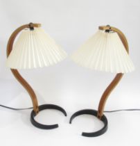 A pair of 1970's Caprani table lamps in laminated wood and iron with original pleated shades. 49cm