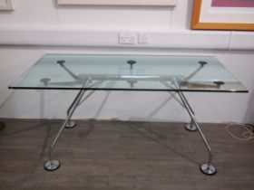 A Tecno 'Nomos' table designed by Sir Norman Foster in chromed metal and glass top, a/f. 160cm x