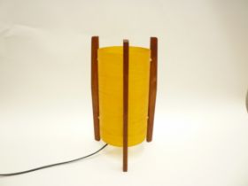 A Rocket table lamp with teak supports and spun resin shade. 30.5cm high