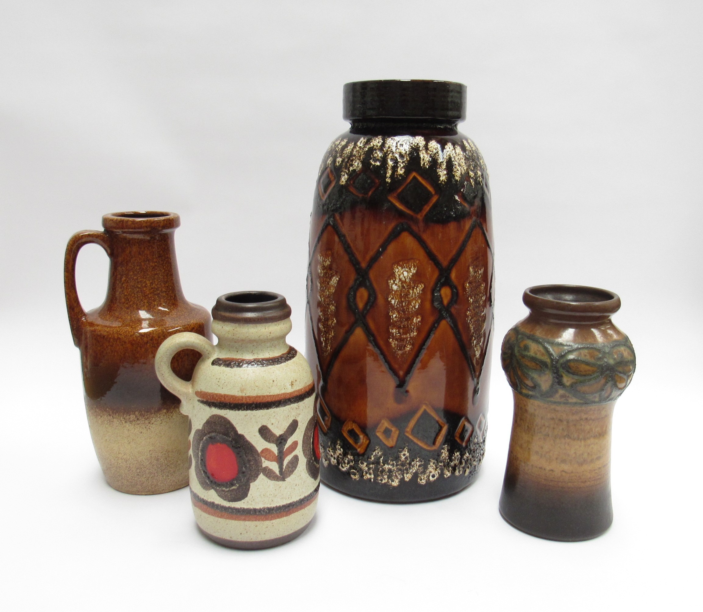 Four West/East German Pottery vases including Strehla, treacle and brown glazes. Tallest 38cm