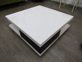A modern coffee table in black and white with two drawers, 90cm x 90cm x 30cm high