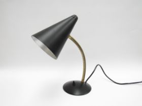 A 1950's conical shade desk lamp in black and brassed metal