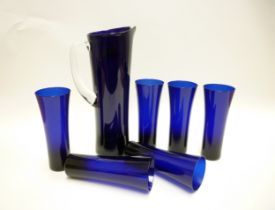 A c1960's blue glass water set including cylindrical jug, 31cm high, together with six glasses.