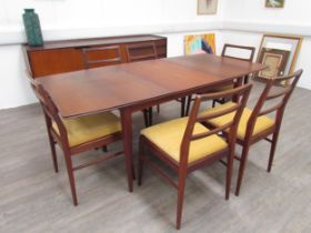 A mid century Richard Hornby extending dining table and six matching chairs. Seats reupholstered and