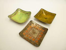 Three mid 20th Century Copper dishes with enamelled decoration in various colours. No makers
