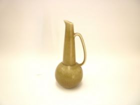 A Rorstrand Gunnar Nylund vase in olive green glaze with single handle. Printed marks to base.