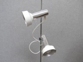 A mid to late 20th Century standard lamp with twin spots in white and chromed metal