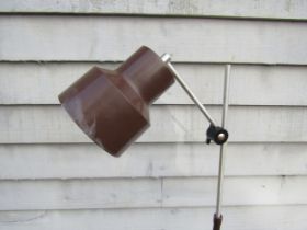 A Danish standard lamp with single adjustable spot in brown painted metal