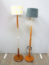Two c1960's Teak standard lamps with later shades