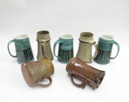 Three Cinque Ports Rye pottery tankards in green and black, an Anthony Morris studio pottery