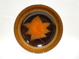 A Poole Pottery Aegean Charger depicting a Maple leaf. 39cm diameter