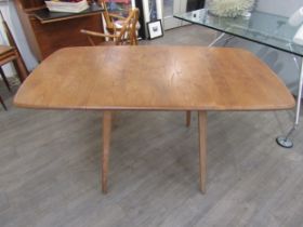 An Ercol light elm finish dining table, square top with twin lift up extensions. Measurement fully