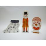 Three Carlton Ware money boxes, Beefeater, Clown and 'Lived in a Shoe'. Tallest 22cm