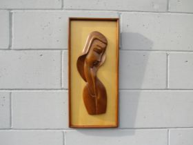 A mid century modern craved wood portrait of a woman, framed, 60cm high