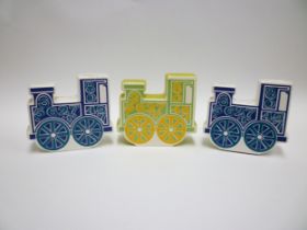 Three Carlton Ware Train money boxes in green and blue colourways. (One blue example is damaged)