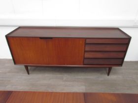 A mid century Richard Hornby sideboard in Afromosia wood, two door cupboard and three slim