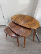 A 1960's Ercol nest of three elm 'Pebble' tables