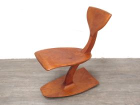 A teak sculptural chair with Whale tail back on rocking base, 73cm high