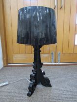 A black 'Kartell' table lamp base with plastic shade. 74cm high