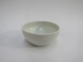 JOANNA CONSTANTINIDIS (1927-2000) A studio pottery white porcelain bowl with impressed potters