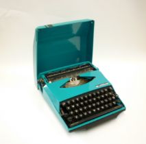A Smith Corona GT Typewriter in blue, 'Design by Ghia'