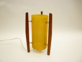 A Rocket table lamp with teak supports and spun fibre shade. 25.5cm high