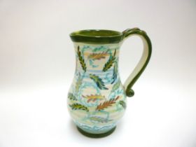 A Denby Pottery jug by Glynn Colledge painted with leaf design. 22.5cm high