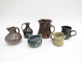 Six various studio pottery jugs, most marked and some with tenmoku glaze. Tallest 13cm high