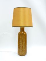 A Bitossi ceramic lamp base in mustard glaze with impressed motif detail, associated shade. Base and