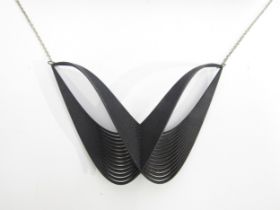 A Wonderlink Jaeger contemporary black abstract necklace in original box