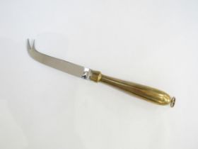 A Georg Jensen Design cheese knife with brass handle, stainless steel blade, 23cm long