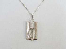 A Modernist Brutalist style sterling silver pendant and vintage box-style silver chain. Stamped