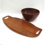 A teak 'surfboard' tray, 66.5cm long x 30cm, together with a large turned wooden bowl, 17cm high x