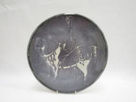 Circle of William Newland, a large mid century studio pottery charger glazed decoration with horse