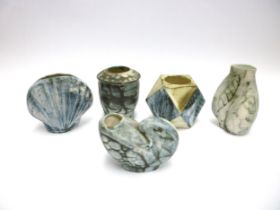 Five various Carn Pottery vases by John Beusmans with floral and geometric detail, one shell form,