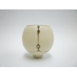 SHEILA FOURNIER (1930-2000) A studio porcelain small oviform vase with pierced hole and bronzed