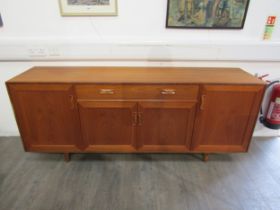 A G-Plan teak sideboard with four cupboard doors and single drawer. 186cm x 45cm x 76cm high