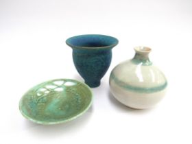 Three pieces of studio pottery including a blue pedestal vase, a delicate pierced green small dish