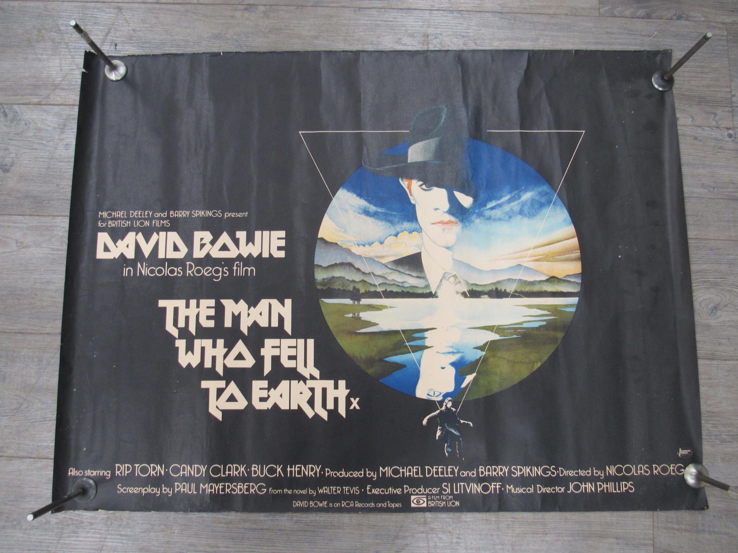 An original UK quad cinema poster for 'The Man Who Fell To Earth' (1976), starring David Bowie,