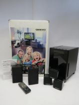 A boxed Onkyo HTX-22HDX digital home cinema surround sound system comprising subwoofer, two