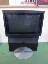 A Bang & Olufsen Beovision Avant television with remote (missing battery cover)