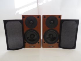 A pair of PMC (Professional Monitor Company Limited) DB1 bookshelf speakers in cherry wood finish,