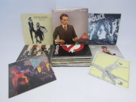 A collection of assorted Rock and Pop LP's and 12" singles including Fleetwood Mac, Tina Turner,