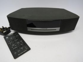 A Bose Wave AWRCC5 CD player with remote