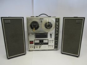 A Sony Tapecorder TC-630 three head solid state reel to reel tape recorder