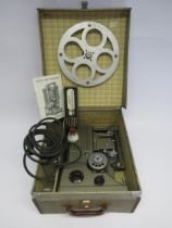 A Specto 500 cine projector in original case with manual and boxed lamp
