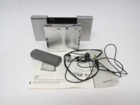A Panasonic SJ-MJ50 portable minidisc player with instructions, headphones and speaker/battery